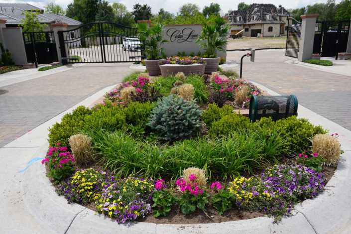 Flower Garden in front of a gated community.